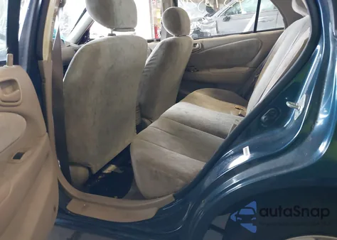 1999 Toyota Corolla Le z USA, uszkodzony, nr VIN 1NXBR18EXXZ169977